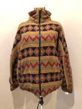 Load image into Gallery viewer, Kingspier Vintage - Reversible jacket with one side black denim and one side colourful green, red, purple ,yellow and black design, front zipper, slash pockets and a drawstring at the waist. 
