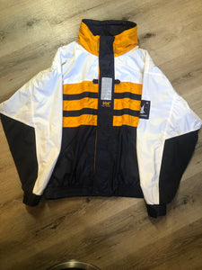 Kingspier Vintage - Heely Hansen ”Extreme” white,yellow and navy windbreaker with funnel neck and roll up hood, zipper and Velcro closures, reflective square on front and Helly Hansen patch on arm. Size XL.