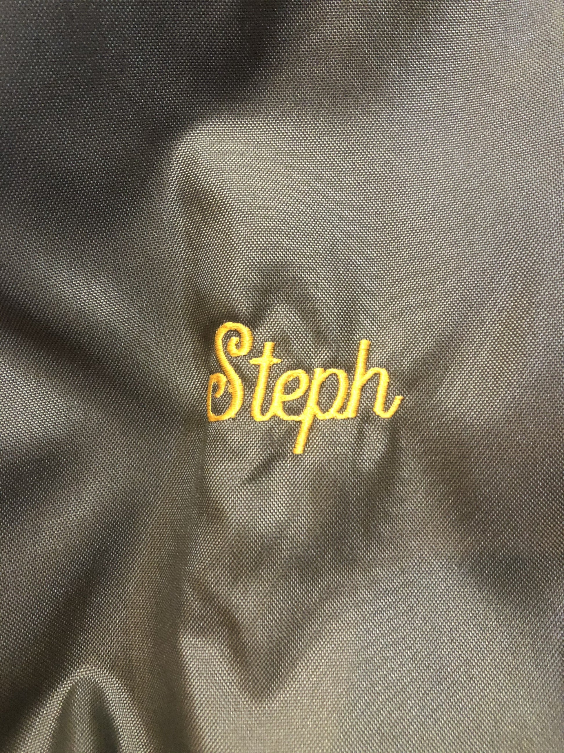 Kingspier Vintage - Havenhill High Soccer varsity jacket in brown with yellow stripe, zipper, front pouch pocket, “Havenhill High” written across the back and “Steph” monogram on the arm. Made in the USA. Size large. 