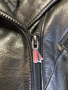 Kingspier Vintage - Hein Gericks black leather motorcycle jacket with fringe detail, zipper, vertical zip pockets lace-up shoulder detail, a quilted lining with inside pocket. Fits Small. 