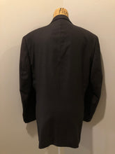 Load image into Gallery viewer, Kingspier Vintage - Bill Blass dark brown 100% pure wool two piece suit. The jacket is a single breasted three button notch lapel with two flap pockets and a beige lining with two inside pockets, Pants are pleated with welt pockets. 
