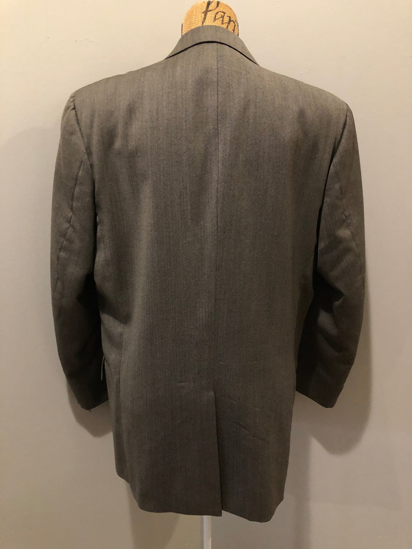 Kingspier Vintage - WM.H. Leishman ( at Tip Top Tailors) two piece medium grey 100% pure virgin wool suit.The jacket is a single breasted, two button notch lapel with two flap pockets and two inside pockets. Pants are pleated with welt pockets. Made in Canada. 