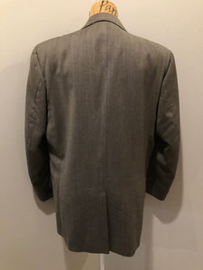 Kingspier Vintage - WM.H. Leishman ( at Tip Top Tailors) two piece medium grey 100% pure virgin wool suit.The jacket is a single breasted, two button notch lapel with two flap pockets and two inside pockets. Pants are pleated with welt pockets. Made in Canada. 