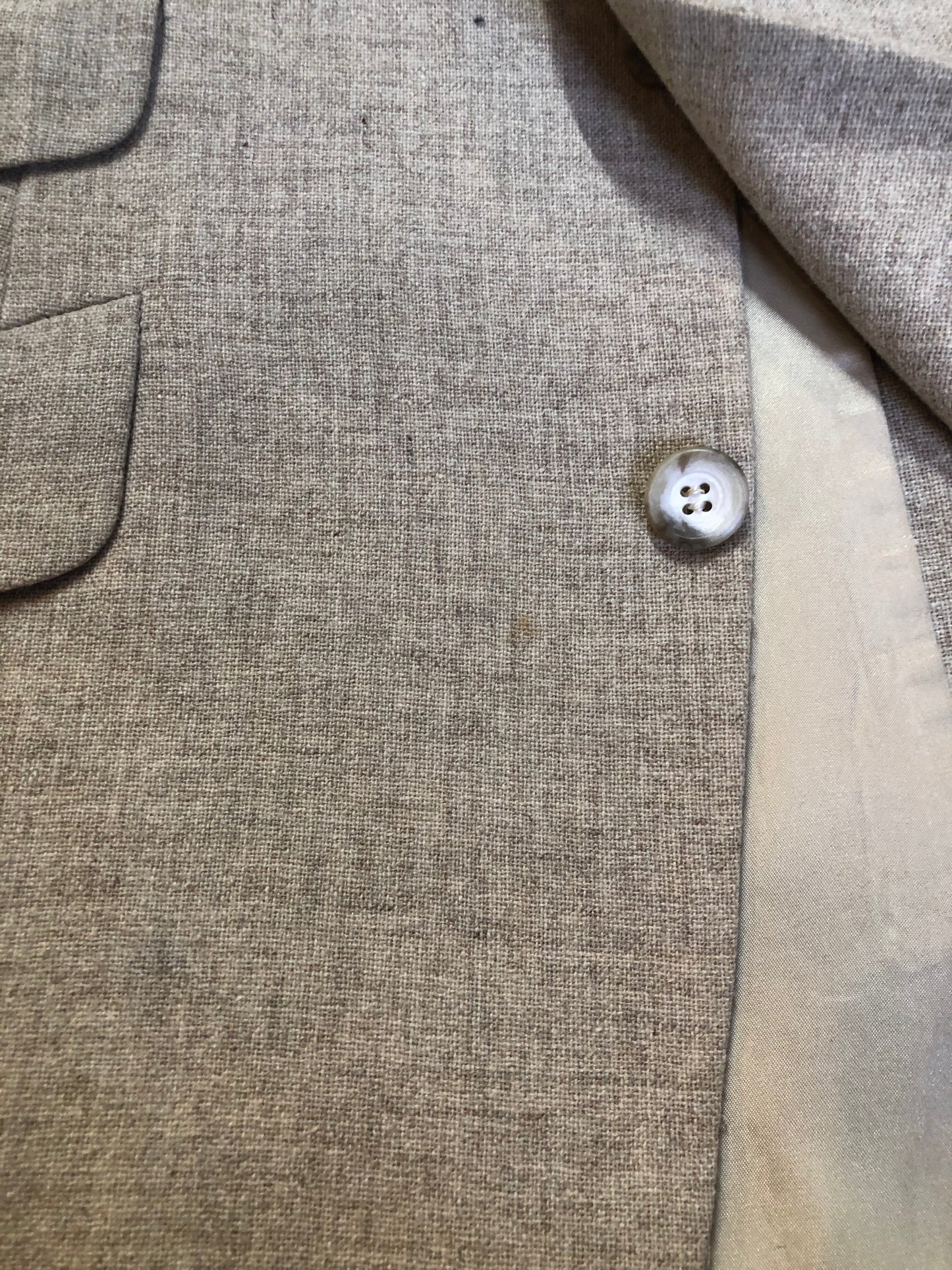 Kingspier Vintage - Chaps by Ralph Lauren light beige two piece suit  at Martini Carl Boston. Jacket is a three button notch lapel with three flap pockets and a breast pocket. The pants are flat front with two slash pockets, a tiny flap pocket in the front and two back pockets.