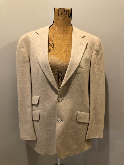 Kingspier Vintage - Chaps by Ralph Lauren light beige two piece suit  at Martini Carl Boston. Jacket is a three button notch lapel with three flap pockets and a breast pocket. The pants are flat front with two slash pockets, a tiny flap pocket in the front and two back pockets.