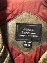 Load image into Gallery viewer, Kingspier Vintage - Sears distressed brown leather motorcycle jacket with zipper, two vertical zip pockets, one flap pocket and a slash pocket on the chest, a belt at the waist and red quilted lining. Size medium.
