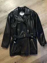 Load image into Gallery viewer, Kingspier Vintage - March New York black lambskin leather jacket with gold zipper, zip slash pockets, belt and storm flap in the back. Leather is buttery soft. Size XS.

