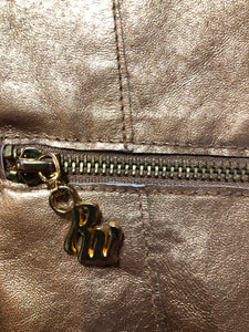 Kingspier Vintage - Rocawear metallic gold leather moto jacket with “RW” detail zippers, chain lace-up detail on sides and “ROCAWEAR” written in chain across the back. There is a front zipper, two horizontal zip pockets on the chest, two snap closures on the stand up collar and a pocket on the inside. Size small.