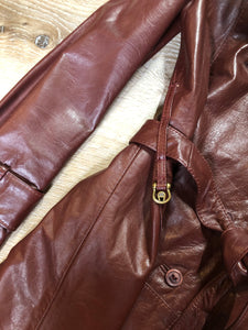 Kingspier Vintage - Etienne Aguier burgundy leather jacket with button closures, patch pockets, belt and “A” decorative details. Size small.