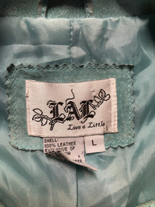 Kingspier Vintage - LAL “Live A LIttle” light teal suede jacket with hidden hook closures, brass grommets running down the front, two zip slash pockets and a small belt at the back. Size large.