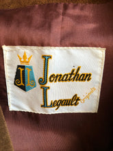 Load image into Gallery viewer, Kingspier Vintage - Jonathan Legault brown suede western style jacket with fringe details, belt in the back, button closures and slash pockets. 
