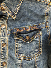 Load image into Gallery viewer, Kingspier Vintage - Hard Rock Cafe denim work shirt style jacket in a “dirty wash” with snap closures, flap pockets, “Hard Rock Cafe” is stitched above the pocket and &quot;Chicago&quot; is stitched on the cuff. Size small.
