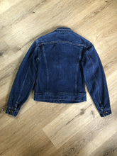 Load image into Gallery viewer, Kingspier Vintage - Lee denim jacket in a medium wash with unique stitching going down the Center front, button closures and two flap pockets on the chest. Union made in the USA. Size 8.
