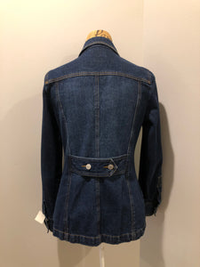 Kingspier Vintage - Isaac Mizrahi denim safari style jacket in a dark wash with belt in the back, button closures, four flap pockets and two hand warmer pockets. Size small.