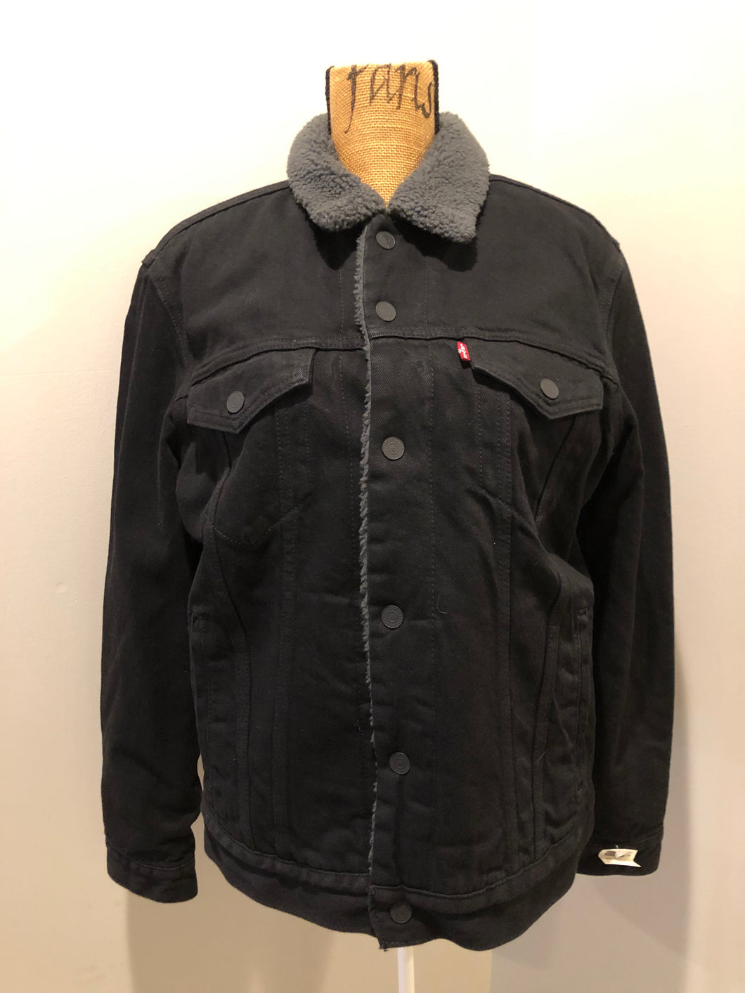 Kingspier Vintage - Levi’s denim sherpa jacket in black with grey faux fur lining, snap closures, vertical pockets, two flap pockets on the chest. Size medium