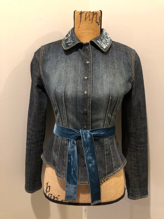 Kingspier Vintage - Elie Tahari denim jacket in a faded dark wash with beaded velvet collar, decorative snap closures, deep green velvet belt and a beautiful patterned silk lining.  Size small.