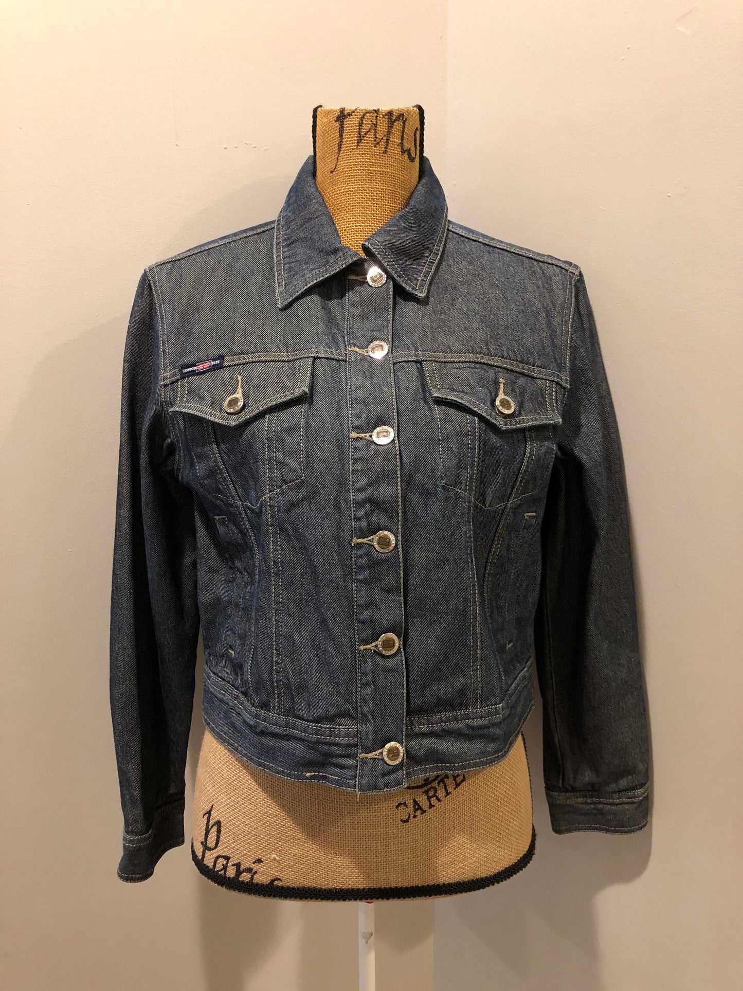 Kingspier Vintage - London Blue denim jacket in faded medium wash with button closures, vertical pockets, flap pockets on the chest and inside pockets. Size 3.