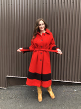 Load image into Gallery viewer, Kingspier Vintage - Hudson’s Bay Company red and black stripe 100% virgin wool point blanket coat in a swing coat style with belt, buckle detail at the collar, button closures, slash pockets and red lining. Size medium/ large.
