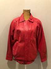Load image into Gallery viewer, Kingspier Vintage - Zaggara Designs red leather jacket with hidden zipper, slash pockets, inside pocket and a belt at the waist. Size small. 
