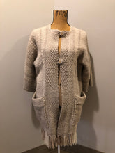 Load image into Gallery viewer, Kingspier Vintage - Daurene Lewis 100% wool hand spun, hand woven and hand made cardigan. The cardigan features two lined patch pockets. two wooden button closures at the top and a wool fringe at the bottom. Made in Annapolis Royal, Nova Scotia.
