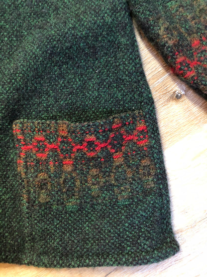 Kingspier Vintage - Deweevers wovens 100% wool cardigan in deep green with red design woven in, patch pockets and silver buttons with floral design. Made in Aylesford, NS. Size medium.