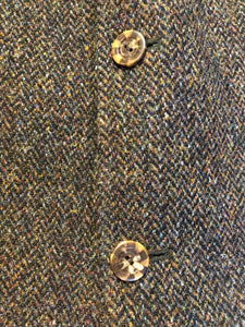 Kingspier Vintage - Harris Tweed brown and blue herringbone 100% wool jacket. This jacket is a three button, notch lapel with two flap pockets, a breast pocket and three inside pockets. Made in the Czech Republic.