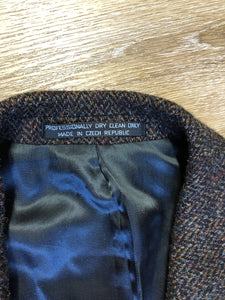 Kingspier Vintage - Harris Tweed brown and blue herringbone 100% wool jacket. This jacket is a three button, notch lapel with two flap pockets, a breast pocket and three inside pockets. Made in the Czech Republic.