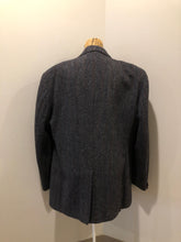Load image into Gallery viewer, Kingspier Vintage - Harris Tweed grey herringbone with subtle red and blue stripe 100% wool jacket. This jacket is a two button, notch lapel with two patch pockets, a breast pocket and three inside pockets.
