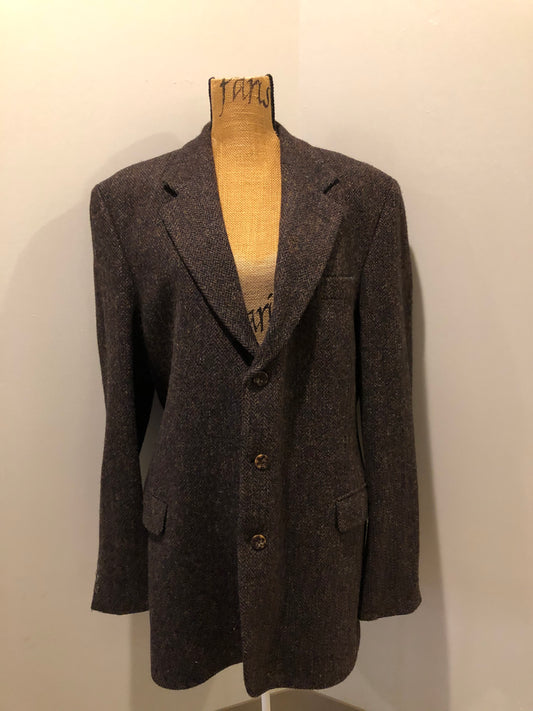 Kingspier Vintage - Harris Tweed brown and blue herringbone 100% wool jacket. This jacket is a three button, notch lapel with two flap pockets, a breast pocket and three inside pockets. Made in the Czech Republic.