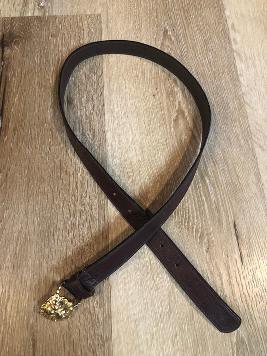 Kingspier Vintage - Vintage Ann Klein Caleche brown textured leather belt with gold lion’s head buckle.