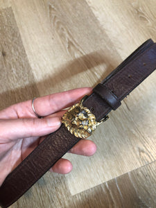 Kingspier Vintage - Vintage Ann Klein Caleche brown textured leather belt with gold lion’s head buckle.