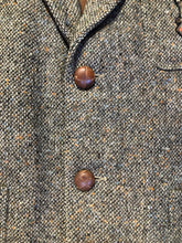 Load image into Gallery viewer, Kingspier Vintage - Donegal handwoven grey with blue and orange flecks 100% wool tweed jacket. This jacket is a two button, notch lapel with two patch pockets, a breast pocket and two inside pockets and a “this I defend” emblem embroidered on the chest. Made in Ireland.
