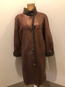 Kingspier Vintage - Rosa Mori by Irma Taylor medium brown shearling coat. This coat features a bronze iridescent finish, shearling trim and lining, button closures and slash pockets. Made in Montreal, Canada, Size medium.