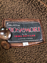 Load image into Gallery viewer, Kingspier Vintage - Rosa Mori by Irma Taylor medium brown shearling coat. This coat features a bronze iridescent finish, shearling trim and lining, button closures and slash pockets. Made in Montreal, Canada, Size medium.
