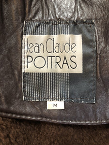 Kingspier Vintage - Jean Claude Poitras medium brown shearling coat. This coat features a speckled texture, shearling lining, zipper and snap closures, one zip pocket on the chest and two welt pockets. Size medium.