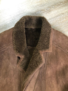 Kingspier Vintage - Hide Society medium brown shearling coat This coat features shearling lining, button closures, pockets and one inside zip pocket. Made in Canada. Size 10.