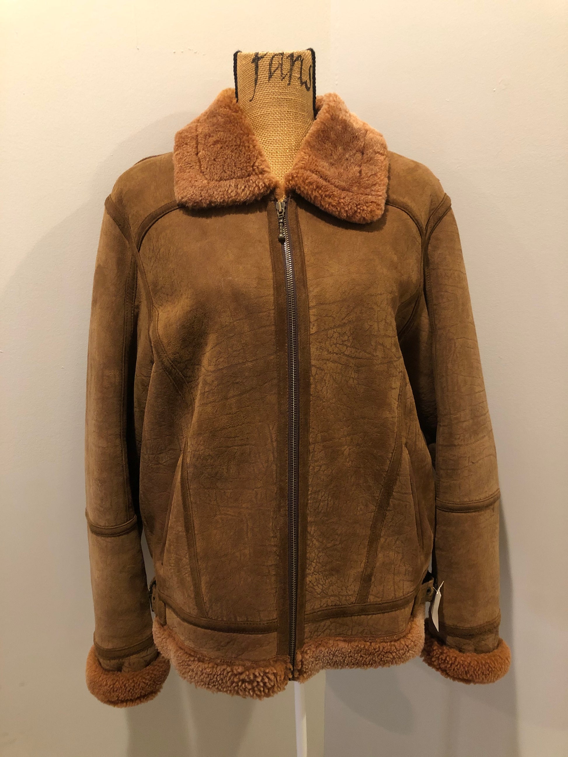 Kingspier Vintage - Hilshien brown shearling bomber coat with shearling trim and lining, zipper closure and slash pockets.