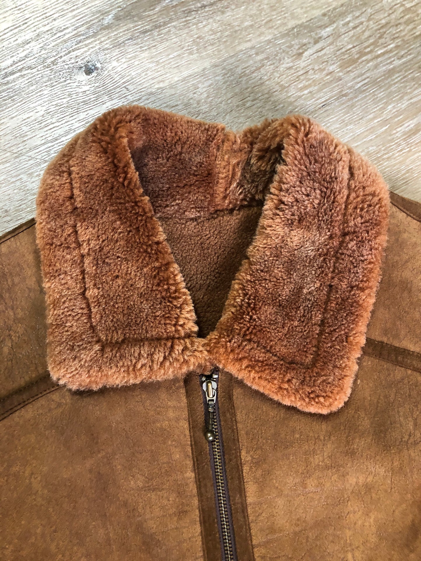 Kingspier Vintage - Hilshien brown shearling bomber coat with shearling trim and lining, zipper closure and slash pockets.