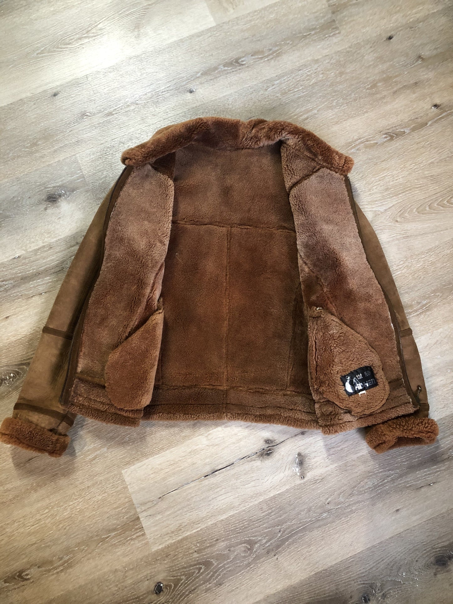 Kingspier Vintage - Hilshien brown shearling bomber coat with shearling trim and lining, zipper closure and slash pockets.