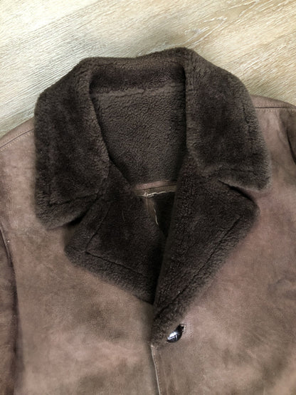 Kingspier Vintage - Bovet medium brown shearling coat. This coat features shearling trim and lining, wooden button closures and patch pockets.