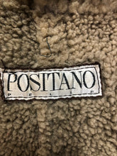 Load image into Gallery viewer, Kingspier Vintage - Positano Pelle dark brown shearling coat. This coat features shearling trim and lining, shall collar, wooden button closures and patch pockets. Made in Turkey. Size small.
