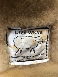 Kingspier Vintage - Ewe Wear, genuine sheepskin hooded bomber style jacket. This jacket features shearling lining, hood, zipper closure and slash pockets. Made in Kingston, Nova Scotia. Size XS.