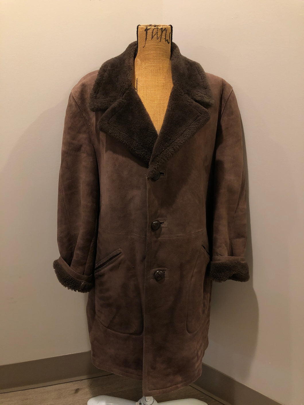 Kingspier Vintage - Bovet medium brown shearling coat. This coat features shearling trim and lining, wooden button closures and patch pockets.