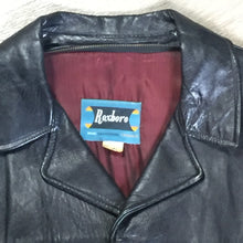 Load image into Gallery viewer, Kingspier Vintage - Roxboro Casuals black leather jacket with button closures, zipper, two flap pockets and a red lining.
