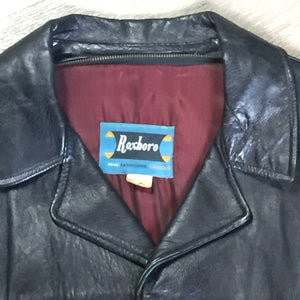Kingspier Vintage - Roxboro Casuals black leather jacket with button closures, zipper, two flap pockets and a red lining.