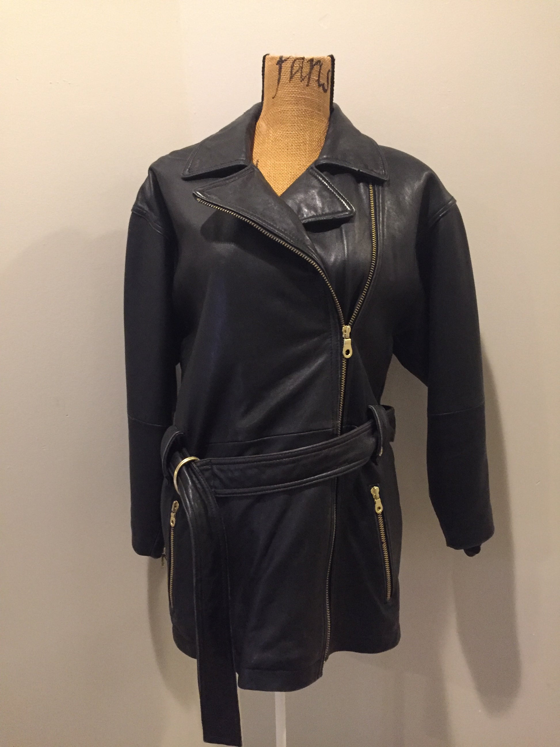 Kingspier Vintage - March New York black lambskin leather jacket with gold zipper, zip slash pockets, belt and storm flap in the back. Leather is buttery soft. Size XS.