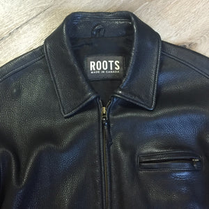 Kingspier Vintage - Roots black pebbled leather jacket with two vertical zip pockets and one zip pocket on the chest. Made in Canada. Size medium.