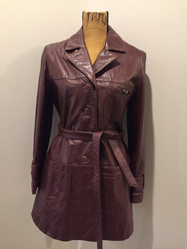 Kingspier Vintage - Etienne Aguier burgundy leather jacket with button closures, patch pockets, belt and “A” decorative details. Size small.