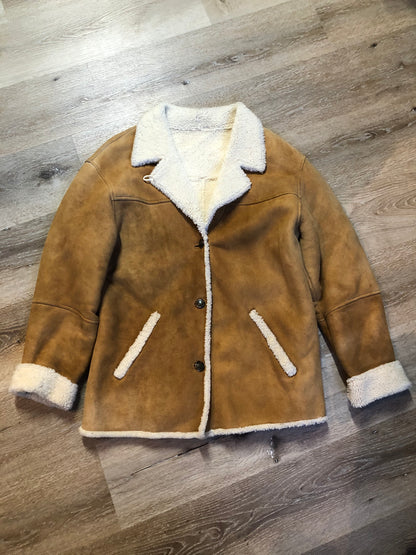 Kingspier Vintage - Timberland tan suede lambskin coat with shearling trim and lining, button closures and slash pockets. Coat is water resistant. Size medium.