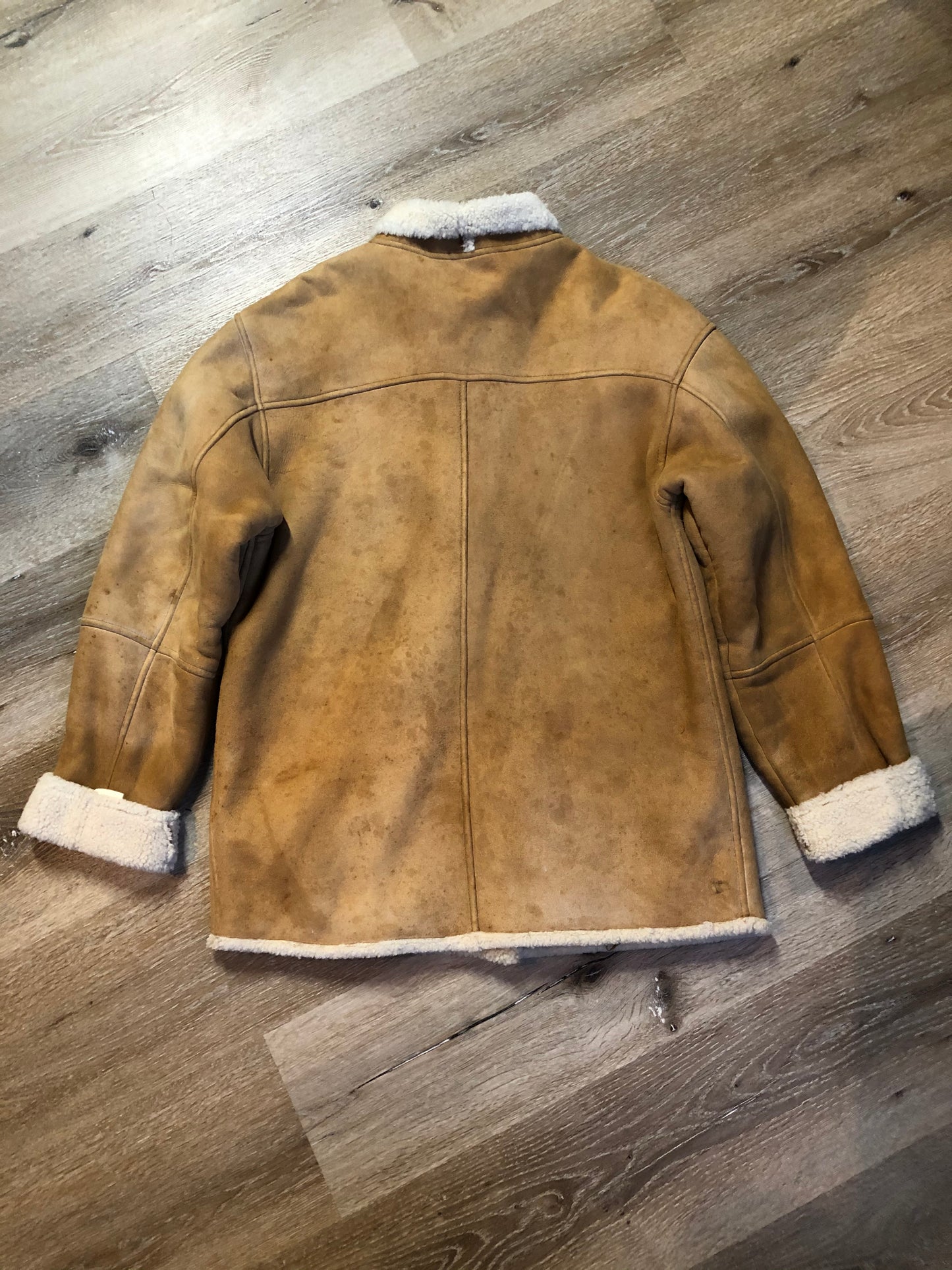 Kingspier Vintage - Timberland tan suede lambskin coat with shearling trim and lining, button closures and slash pockets. Coat is water resistant. Size medium.